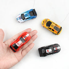 #0504 1~8PCS Multi-color Mini Can Car Remote Control Micro Racing RC Car With Led Light Kid's Desktop Toys Car